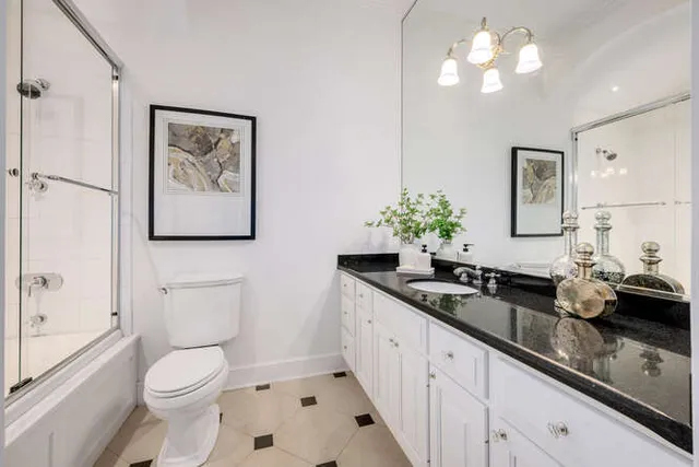 a dining room with furniture a window and wooden floor