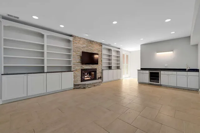 a bathroom with a granite countertop sink toilet a mirror and shower