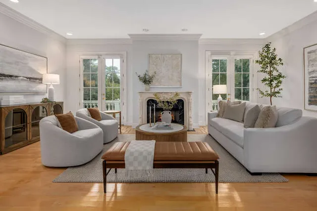 a living room with furniture and a fireplace