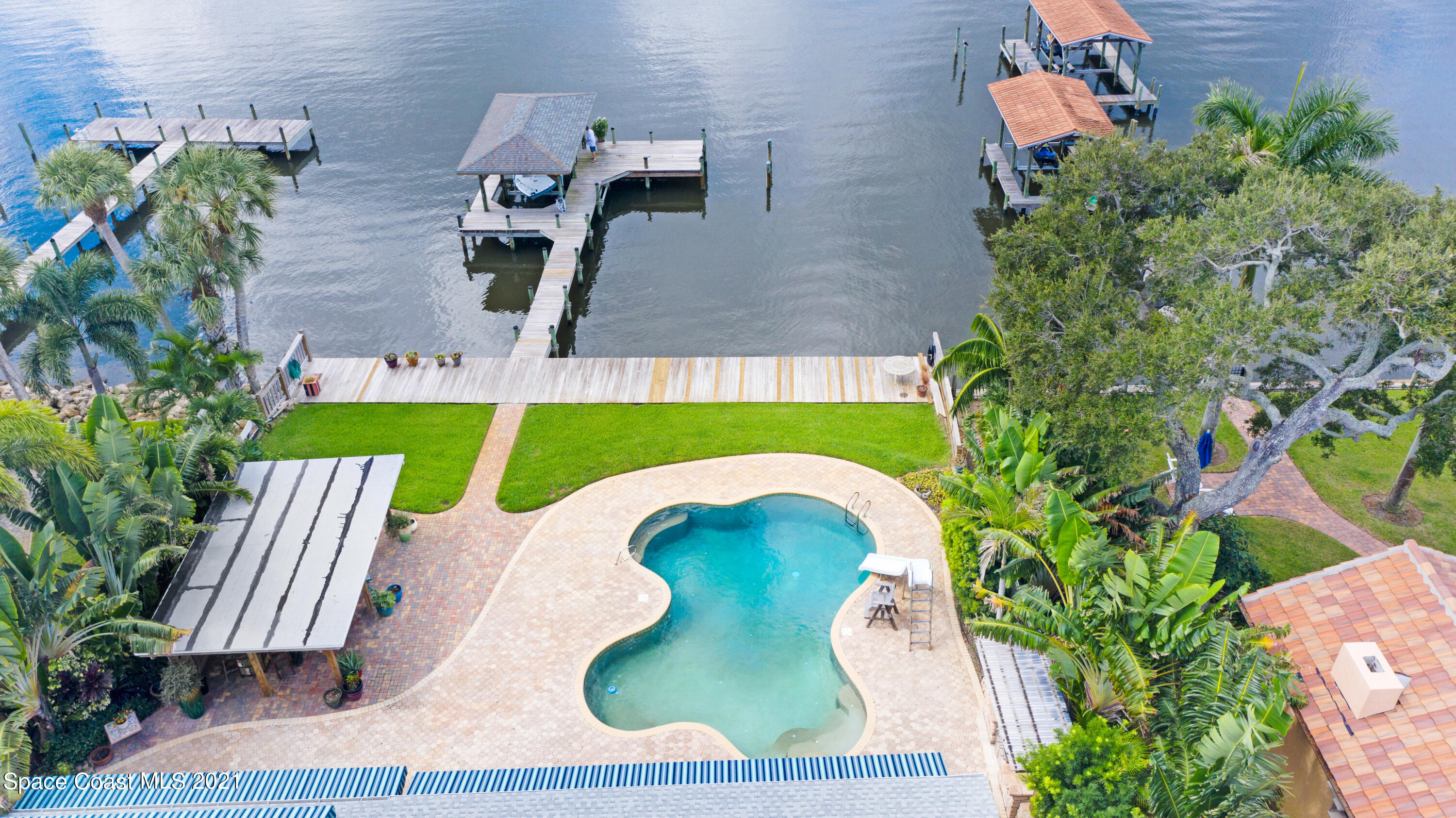 600 North Riverside Drive Indialantic, FL 32903 - Photo 11 of 85 an aerial view of a swimming pool