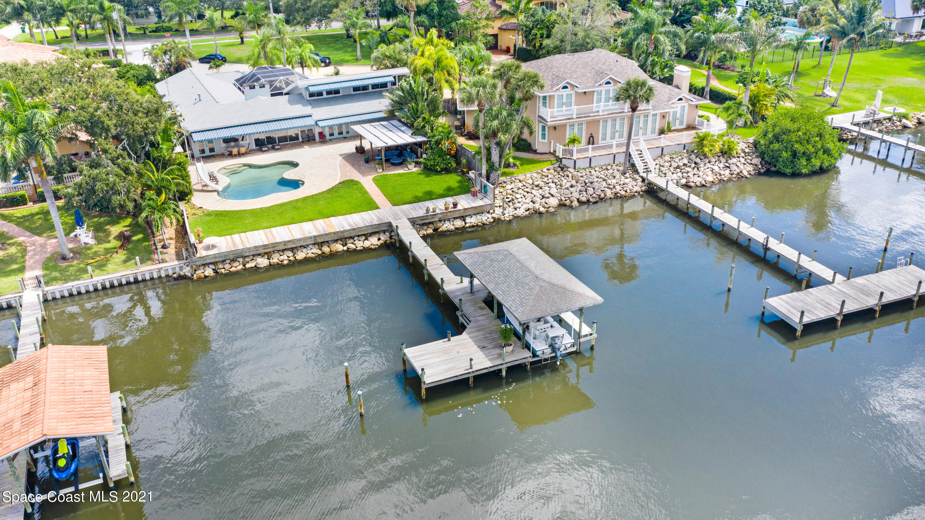 600 North Riverside Drive Indialantic, FL 32903 - Photo 12 of 85 an aerial view of a house with a garden and lake view
