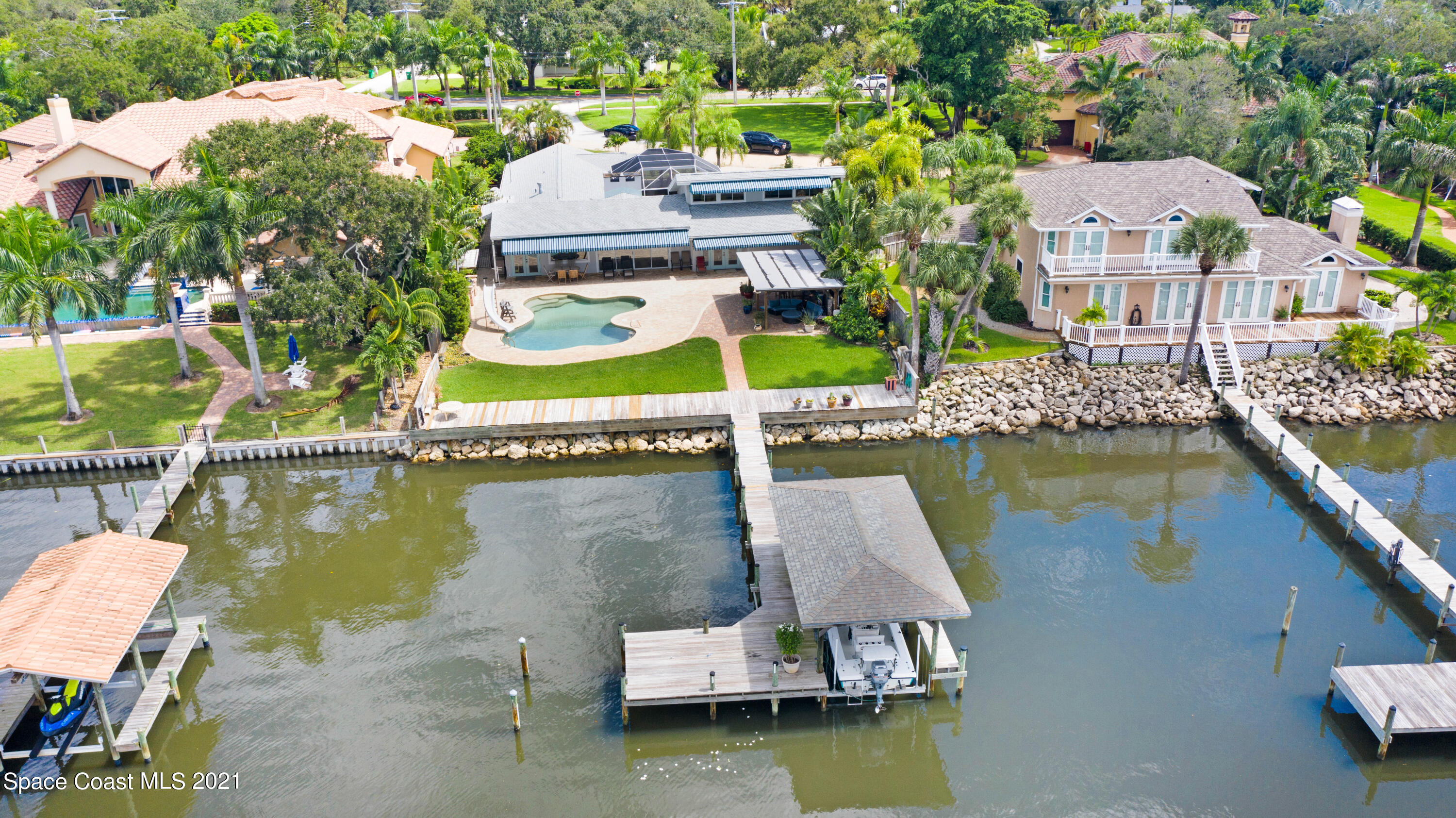 600 North Riverside Drive Indialantic, FL 32903 - Photo 13 of 85 an aerial view of a house with swimming pool and outdoor space