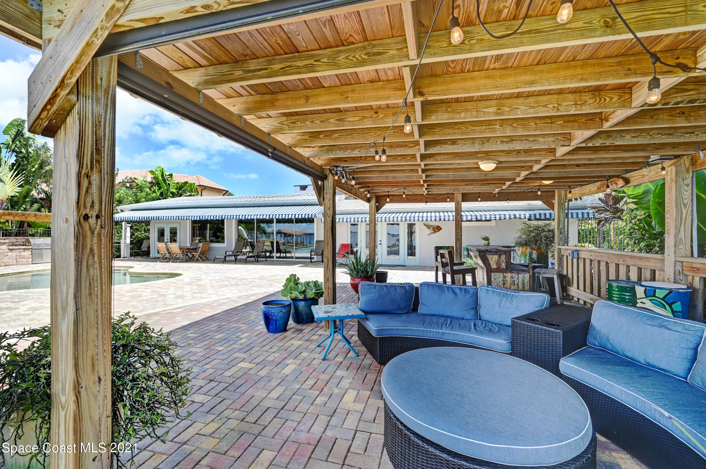 600 North Riverside Drive Indialantic, FL 32903 - Photo 28 of 85 a view of a patio with couches chairs and wooden floor