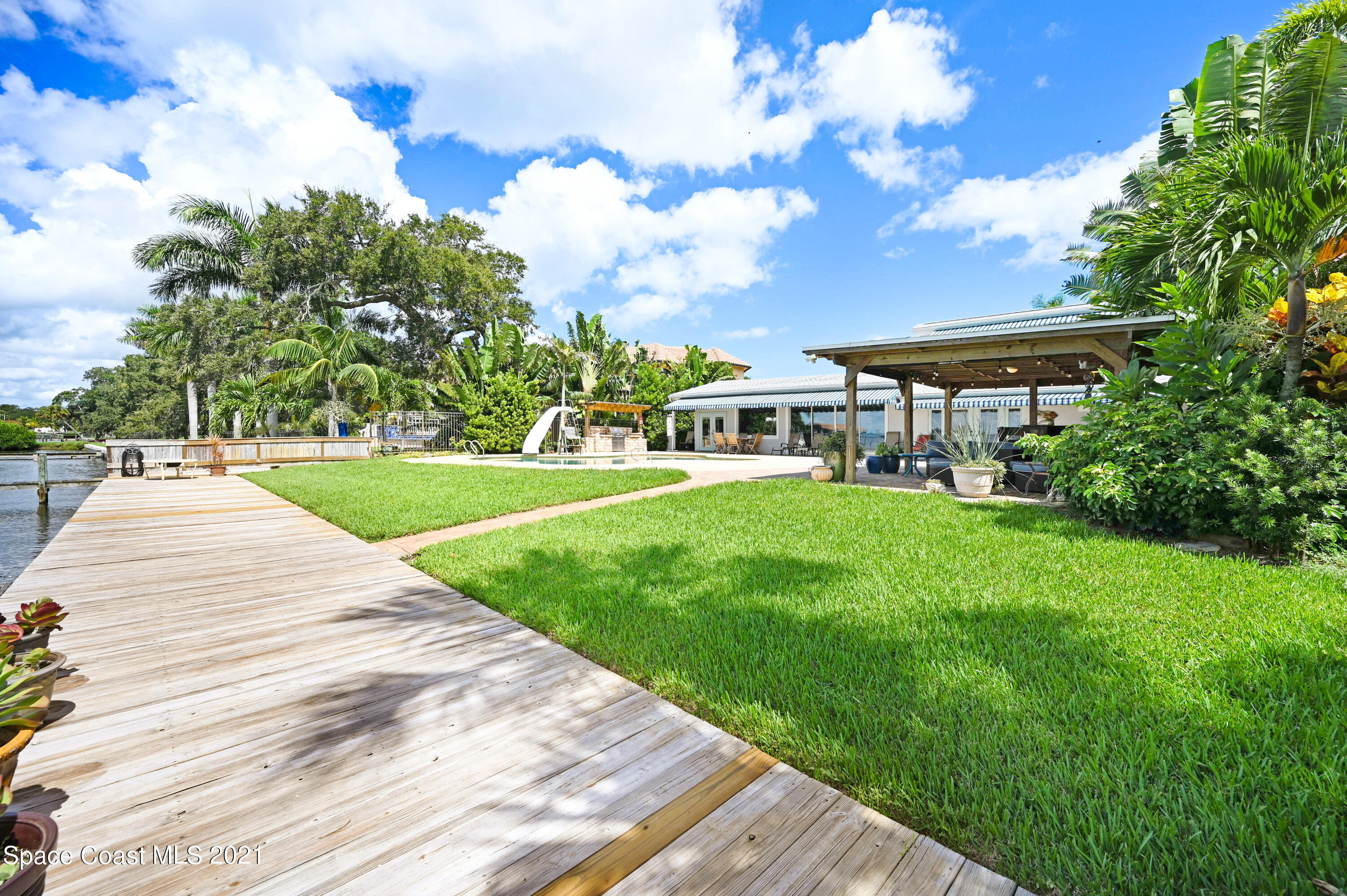 600 North Riverside Drive Indialantic, FL 32903 - Photo 29 of 85 a view of a house with a yard
