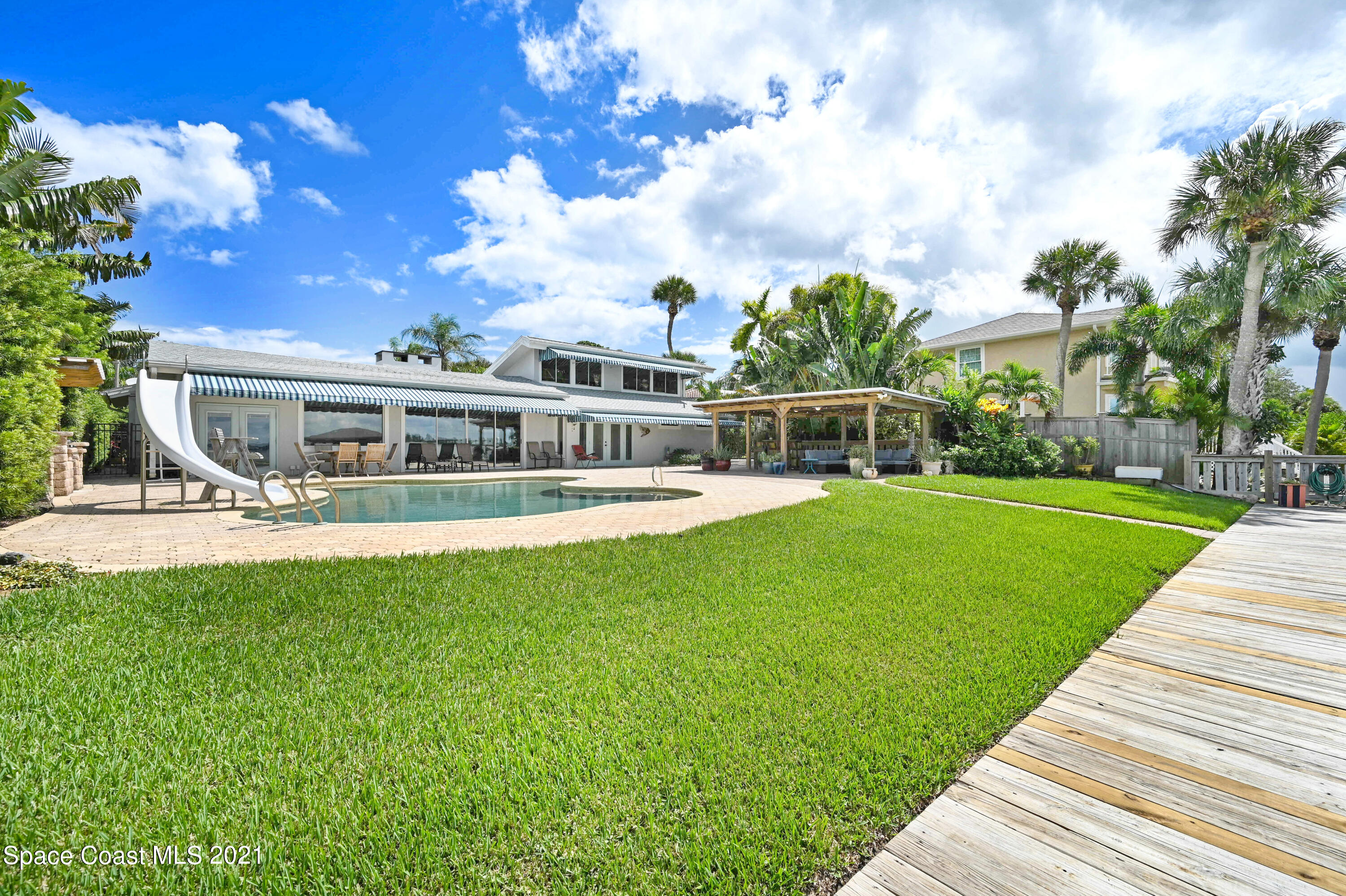 600 North Riverside Drive Indialantic, FL 32903 - Photo 30 of 85 a view of house with a swimming pool