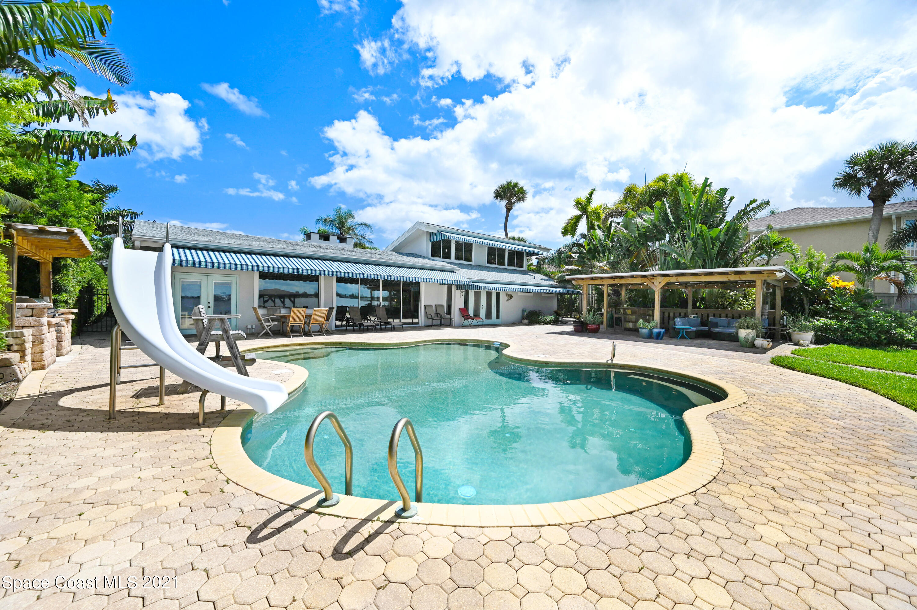 600 North Riverside Drive Indialantic, FL 32903 - Photo 31 of 85 a view of a house with swimming pool