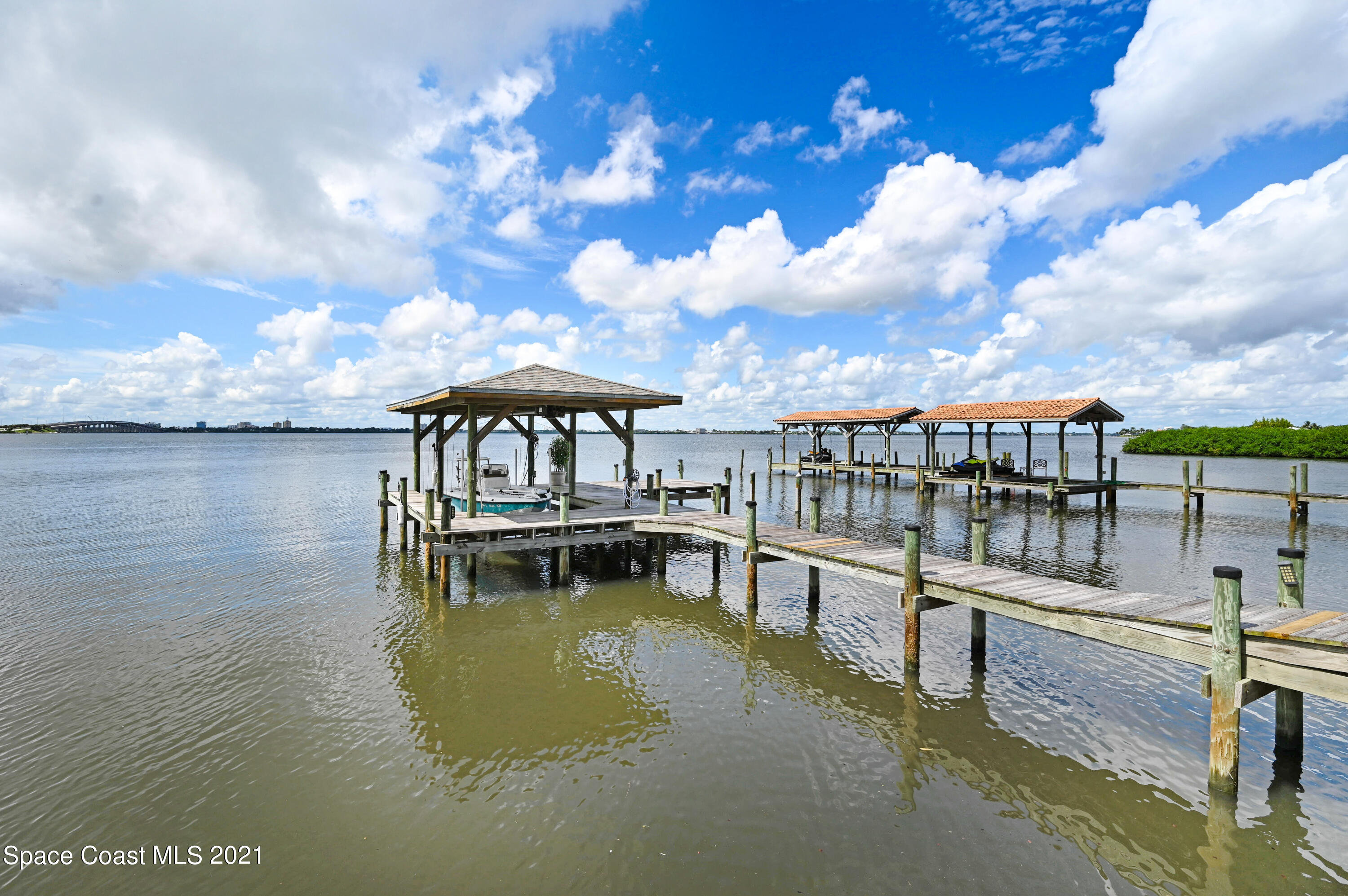 600 North Riverside Drive Indialantic, FL 32903 - Photo 34 of 85 a view of a swimming pool with an outdoor seating