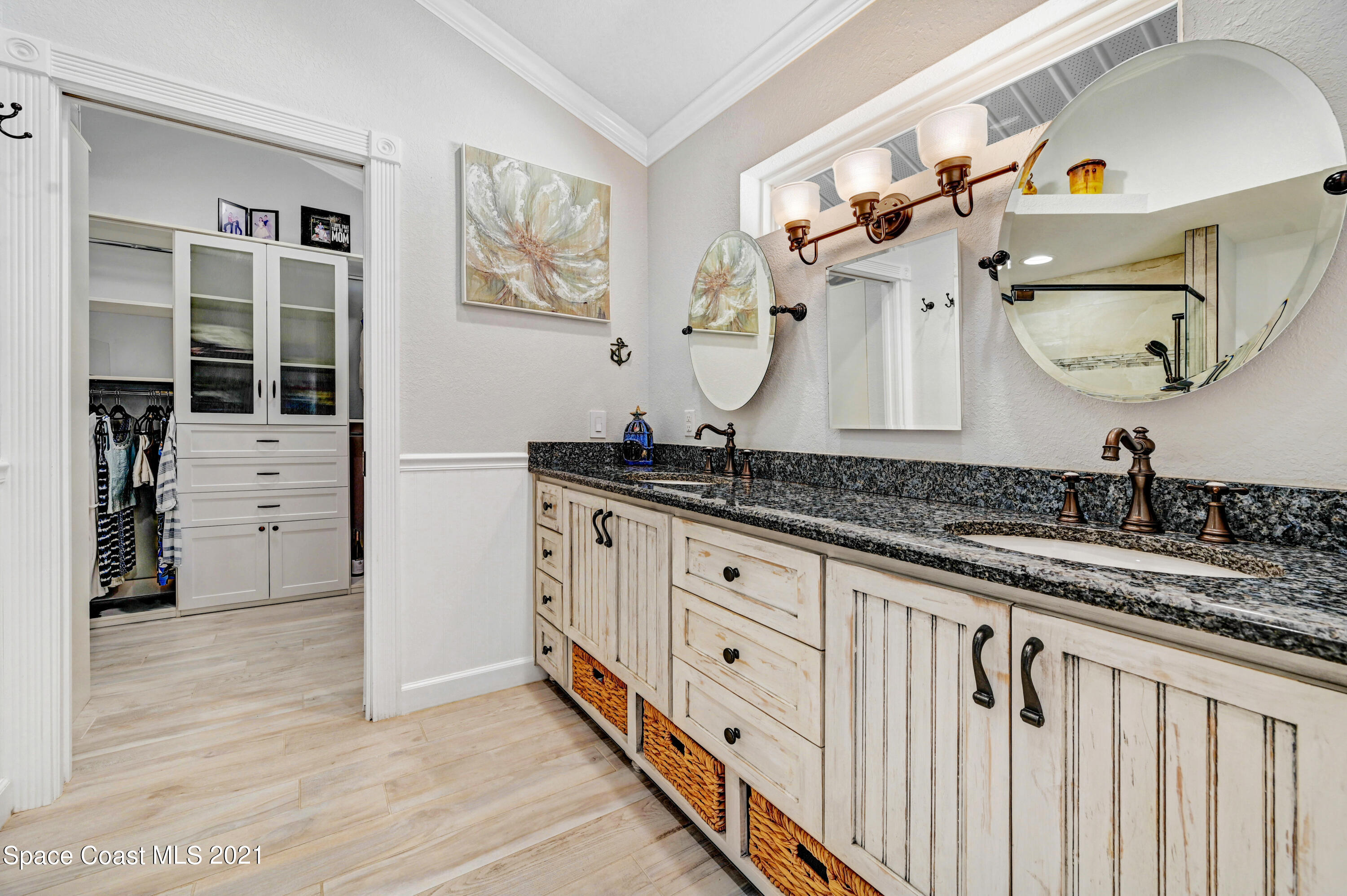 600 North Riverside Drive Indialantic, FL 32903 - Photo 61 of 85 a bathroom with a sink and a mirror