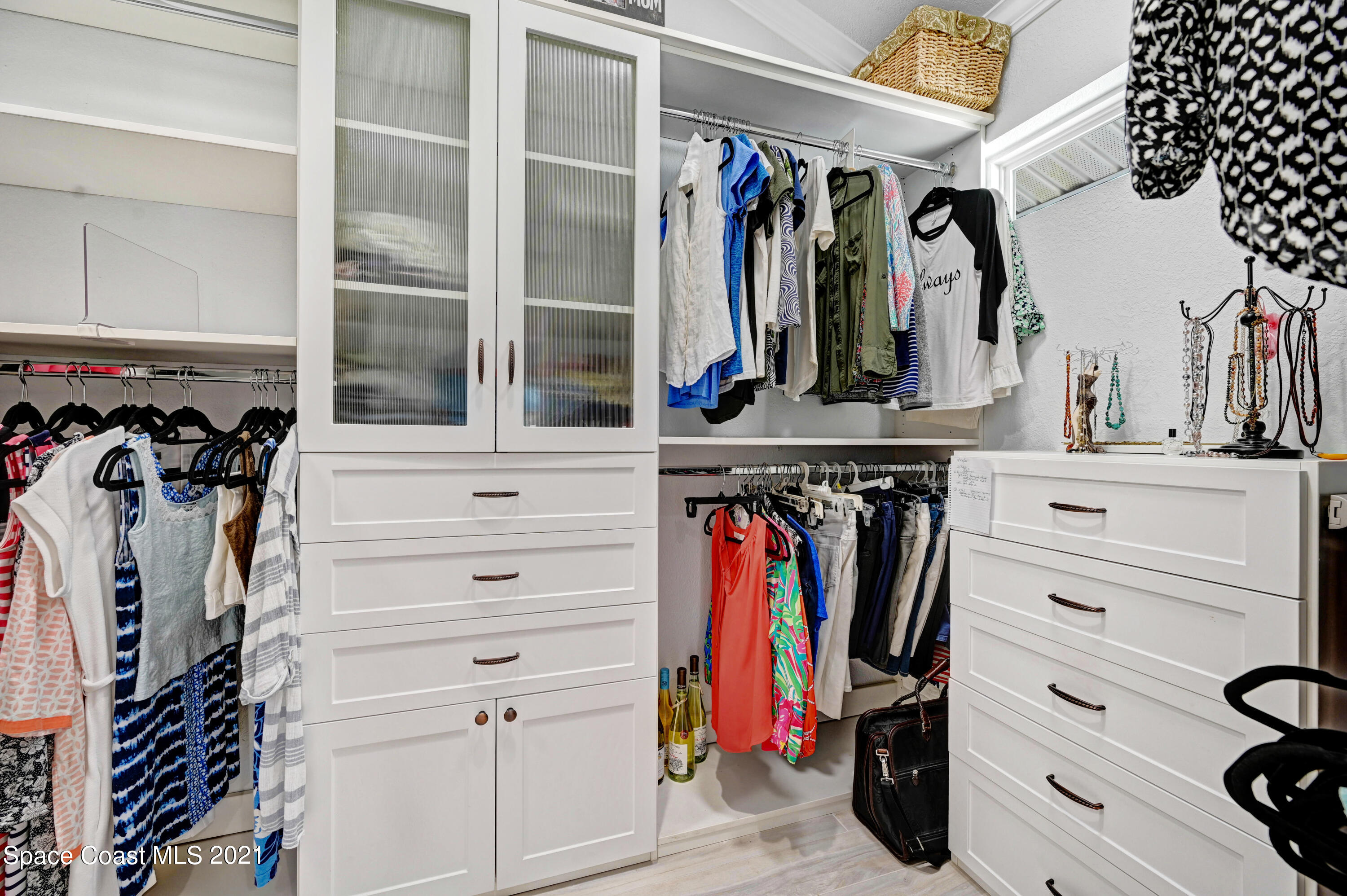 600 North Riverside Drive Indialantic, FL 32903 - Photo 63 of 85 a view of walk in closet with clothes and shoes