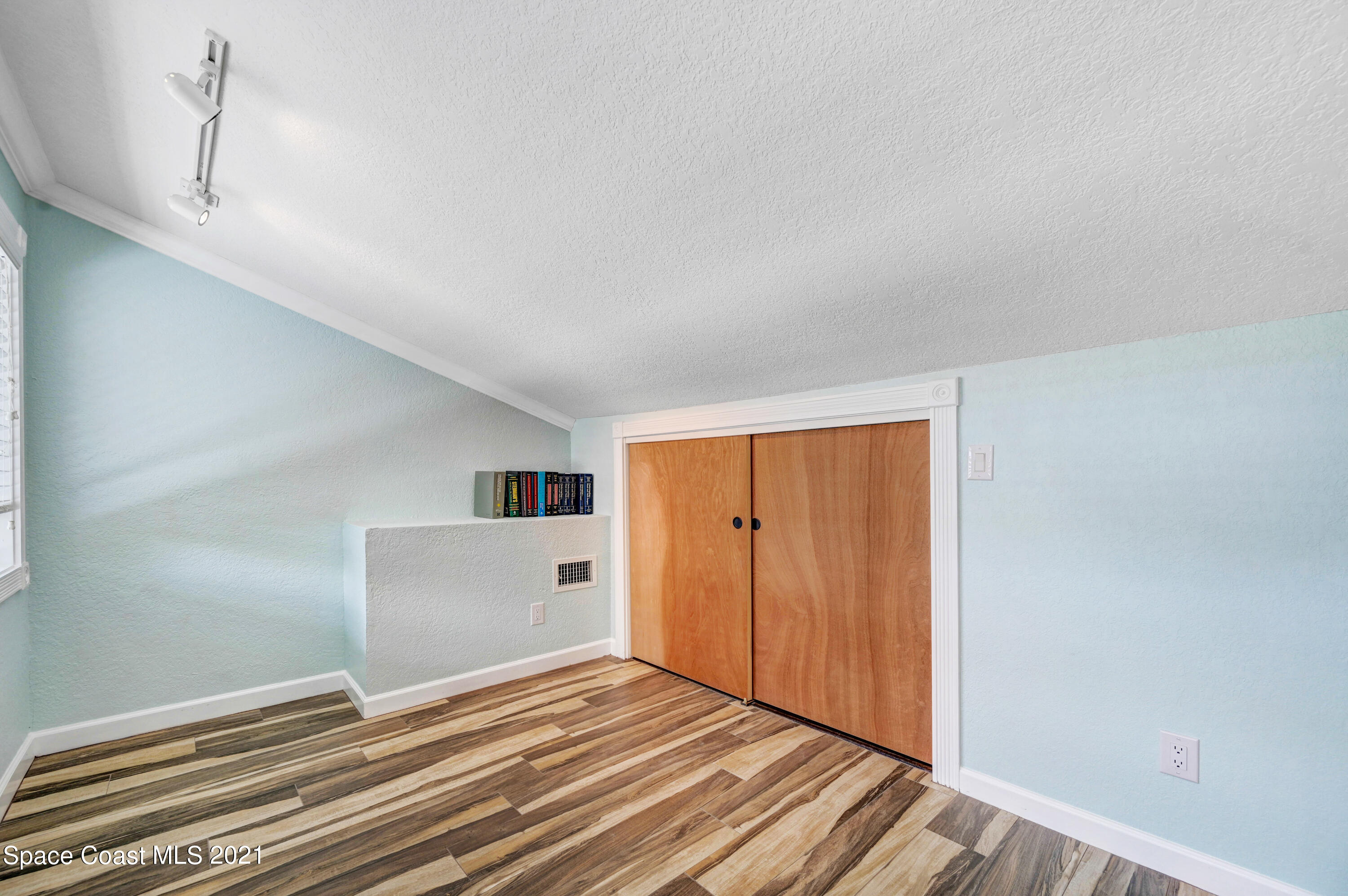 600 North Riverside Drive Indialantic, FL 32903 - Photo 73 of 85 a view of empty room with wooden floor