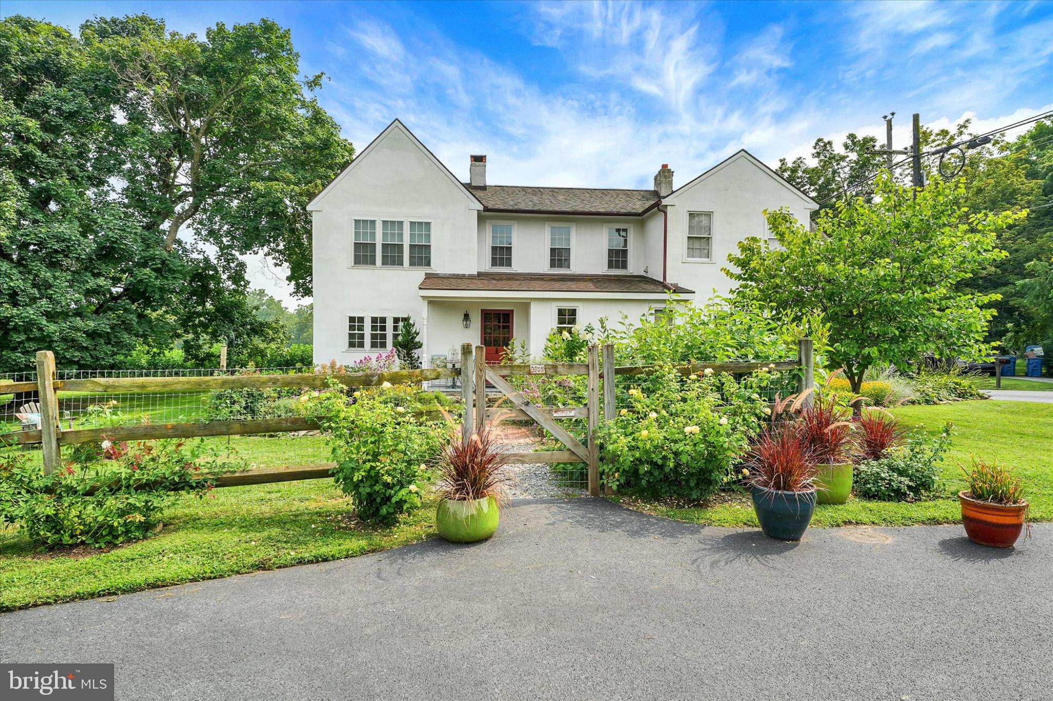 180 Springdell Road Coatesville, PA 19320 - Photo 1 of 55 a front view of a house with a garden and pathway