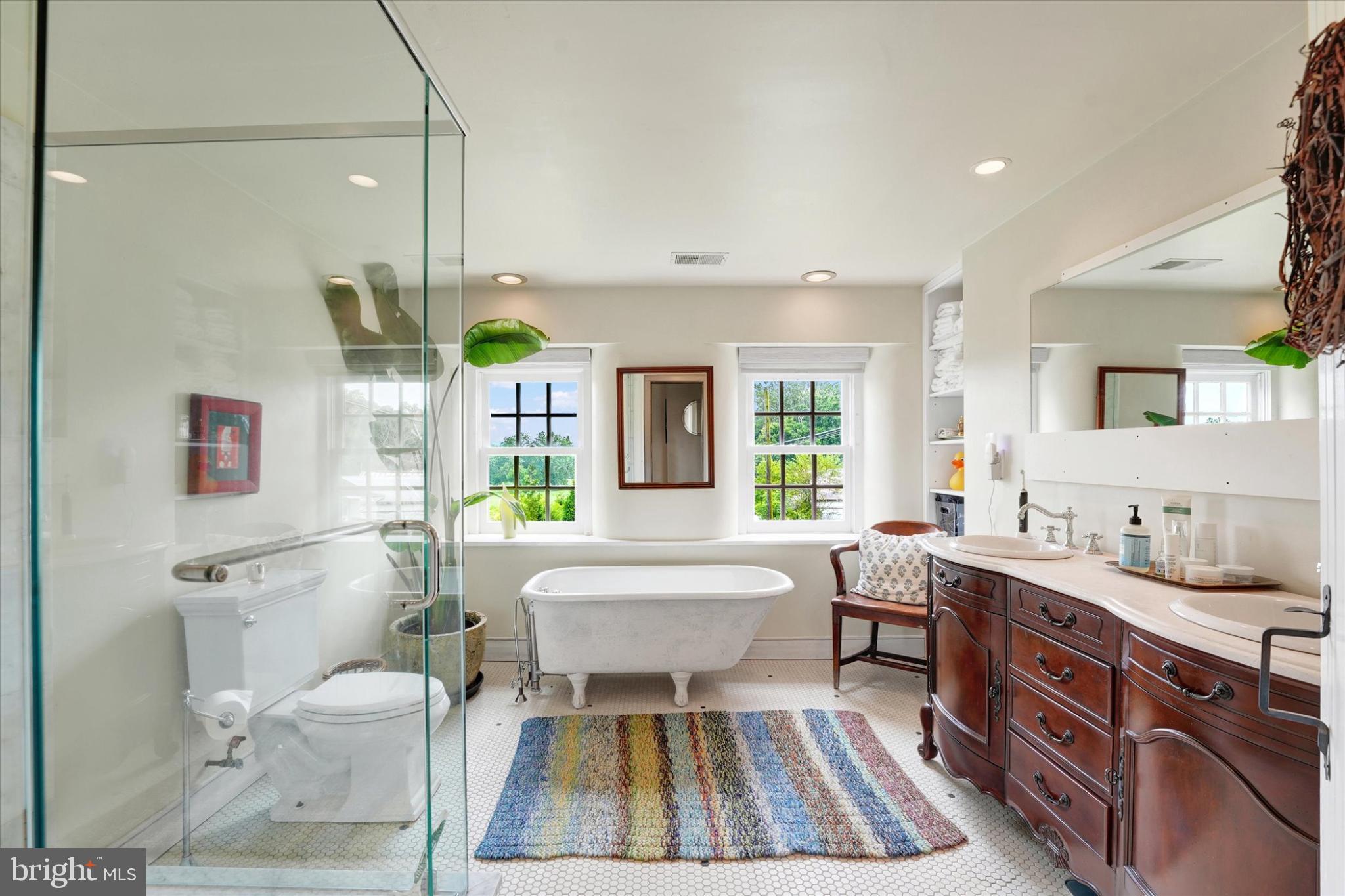 180 Springdell Road Coatesville, PA 19320 - Photo 27 of 55 a spacious bathroom with a granite countertop tub sink a mirror a toilet and a shower