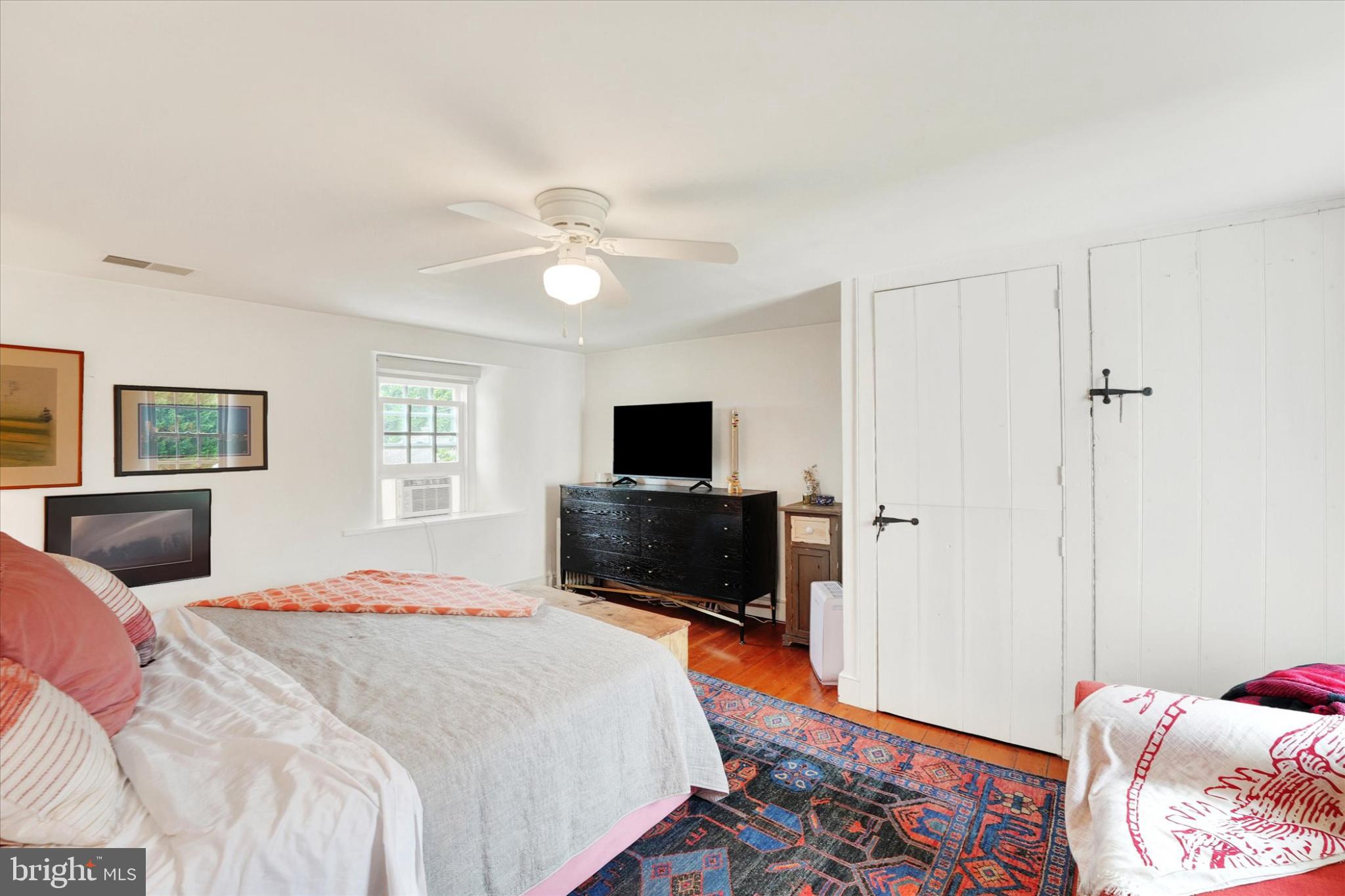 180 Springdell Road Coatesville, PA 19320 - Photo 29 of 55 a bedroom with a bed and a flat screen tv