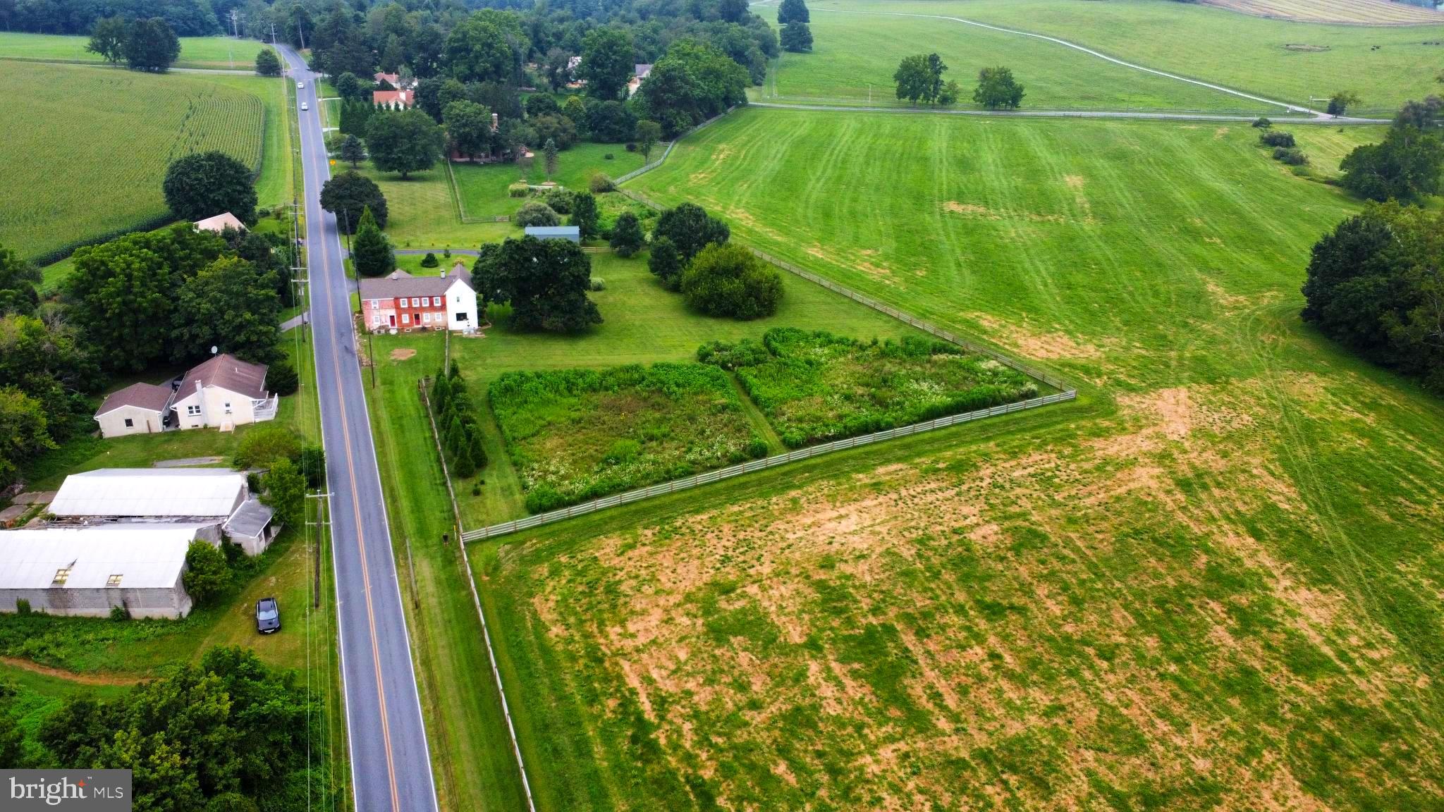 180 Springdell Road Coatesville, PA 19320 - Photo 41 of 55 Serene countryside with lush green fields.