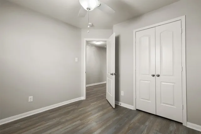 an empty room with wooden floor