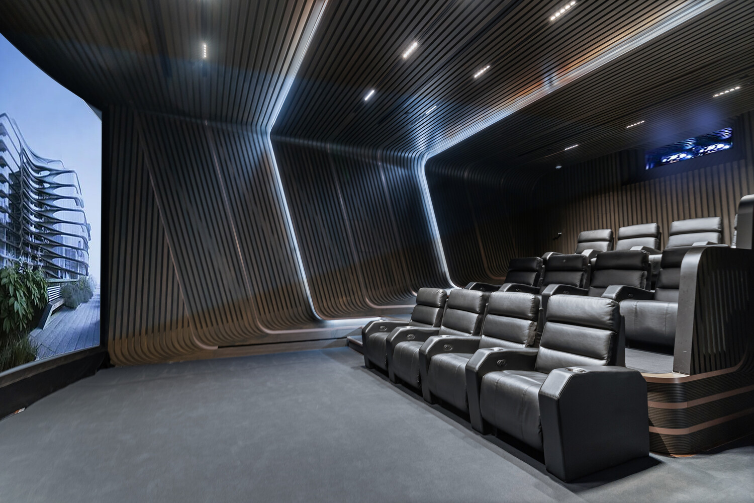 520 West 28th Street, Unit 7 Manhattan, NY 10001 - Photo 14 of 24 a media room with lots of chairs and a projector screen