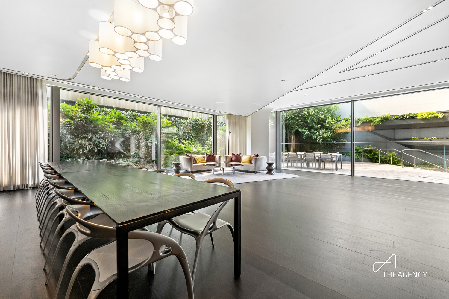 520 West 28th Street, Unit 7 Manhattan, NY 10001 - Photo 18 of 24 a view of a dining room with furniture large windows and wooden floor