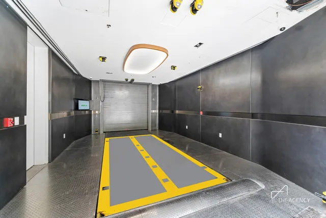 a view of a patio with table and chairs and potted plants with wooden floor and fence