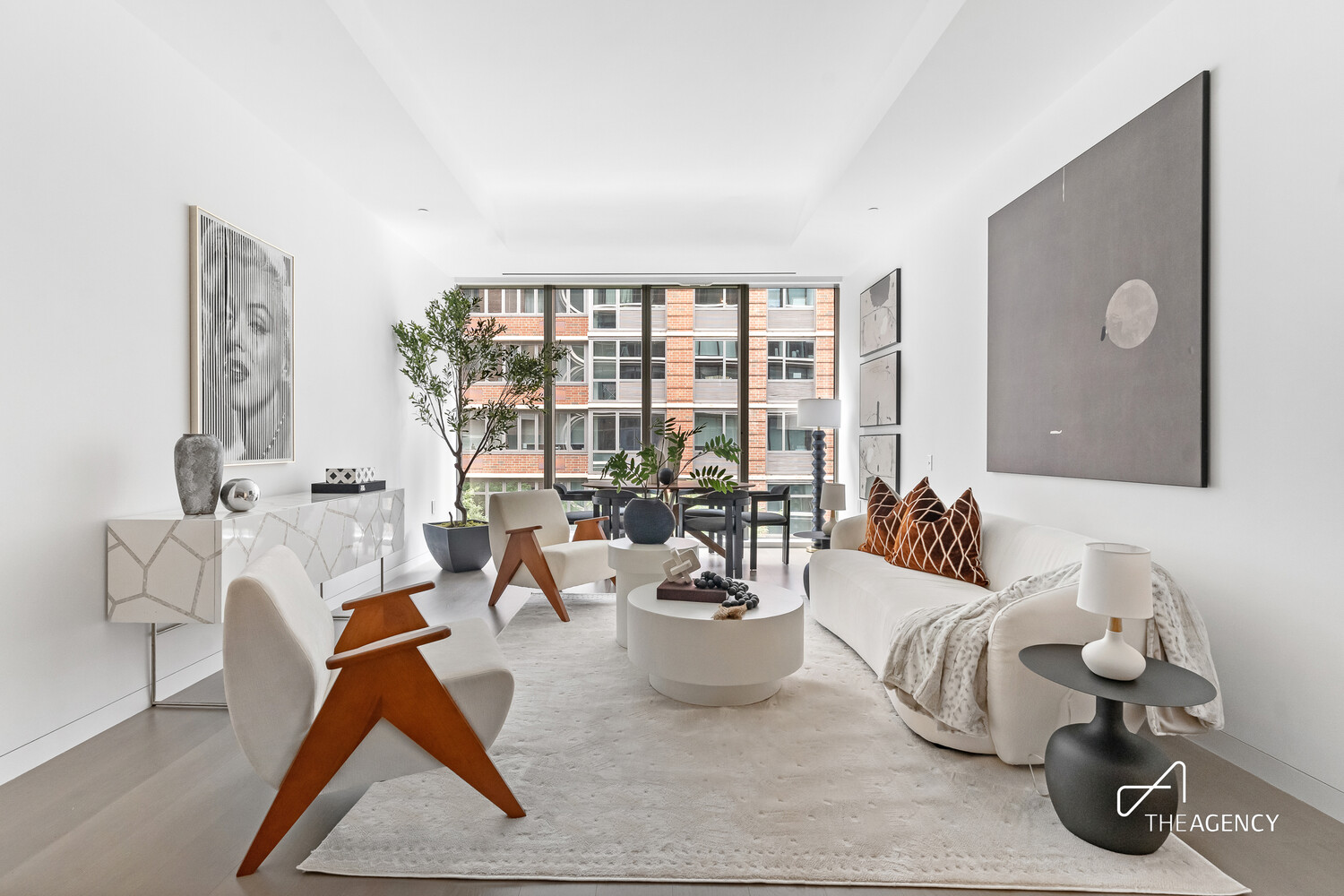 520 West 28th Street, Unit 7 Manhattan, NY 10001 - Photo 2 of 24 a living room with furniture and a potted plant