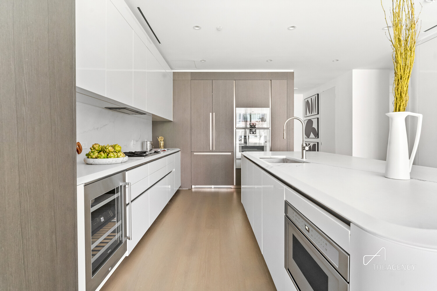 520 West 28th Street, Unit 7 Manhattan, NY 10001 - Photo 3 of 24 a large white kitchen with a large window