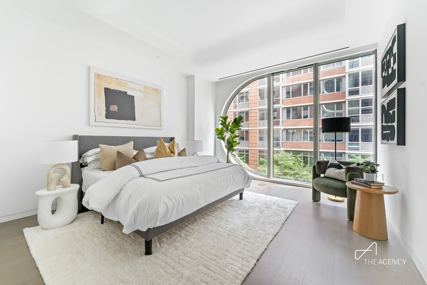 520 West 28th Street, Unit 7 Manhattan, NY 10001 - Photo 4 of 24 a bedroom with a large bed and a couch