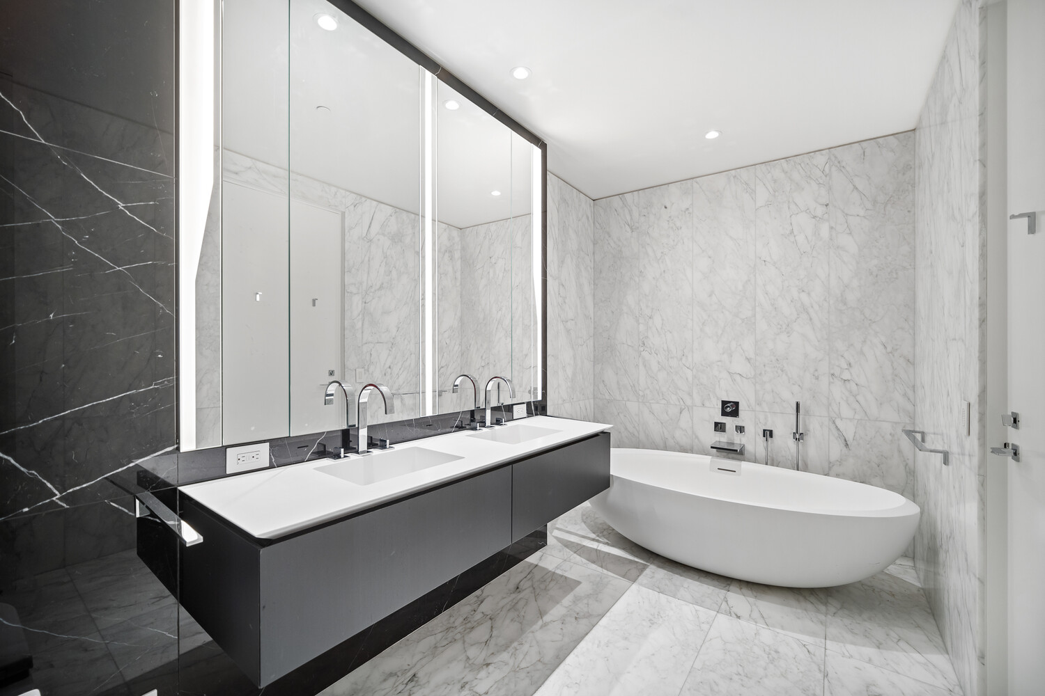 520 West 28th Street, Unit 7 Manhattan, NY 10001 - Photo 5 of 24 a bathroom with a double vanity sink and a mirror