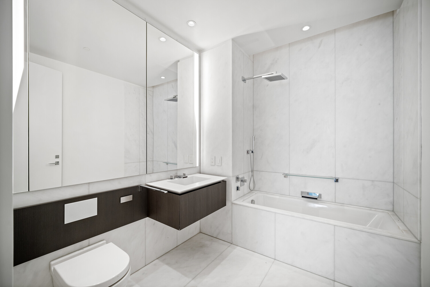 520 West 28th Street, Unit 7 Manhattan, NY 10001 - Photo 9 of 24 a bathroom with a sink a toilet and shower