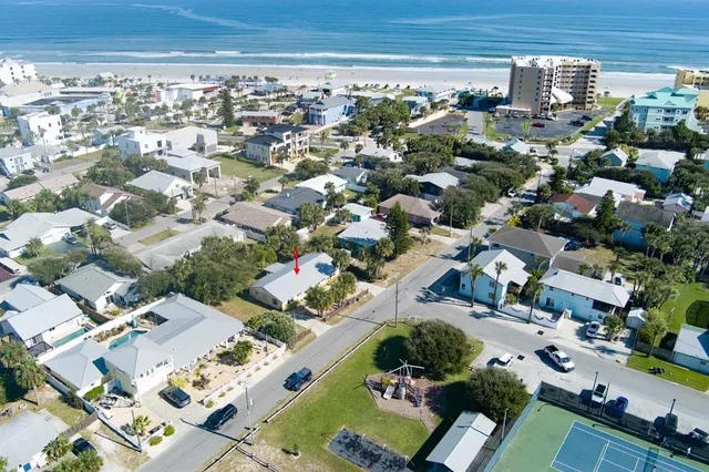 an aerial view of residential houses with outdoor space