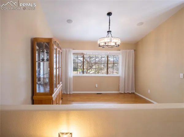 a view of a windows and chandelier in a room