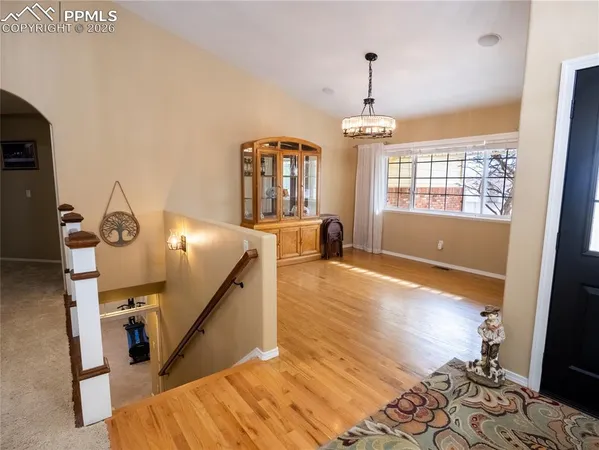 a view of entryway with wooden floor