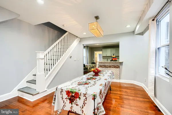 a kitchen with granite countertop appliances a sink and cabinets