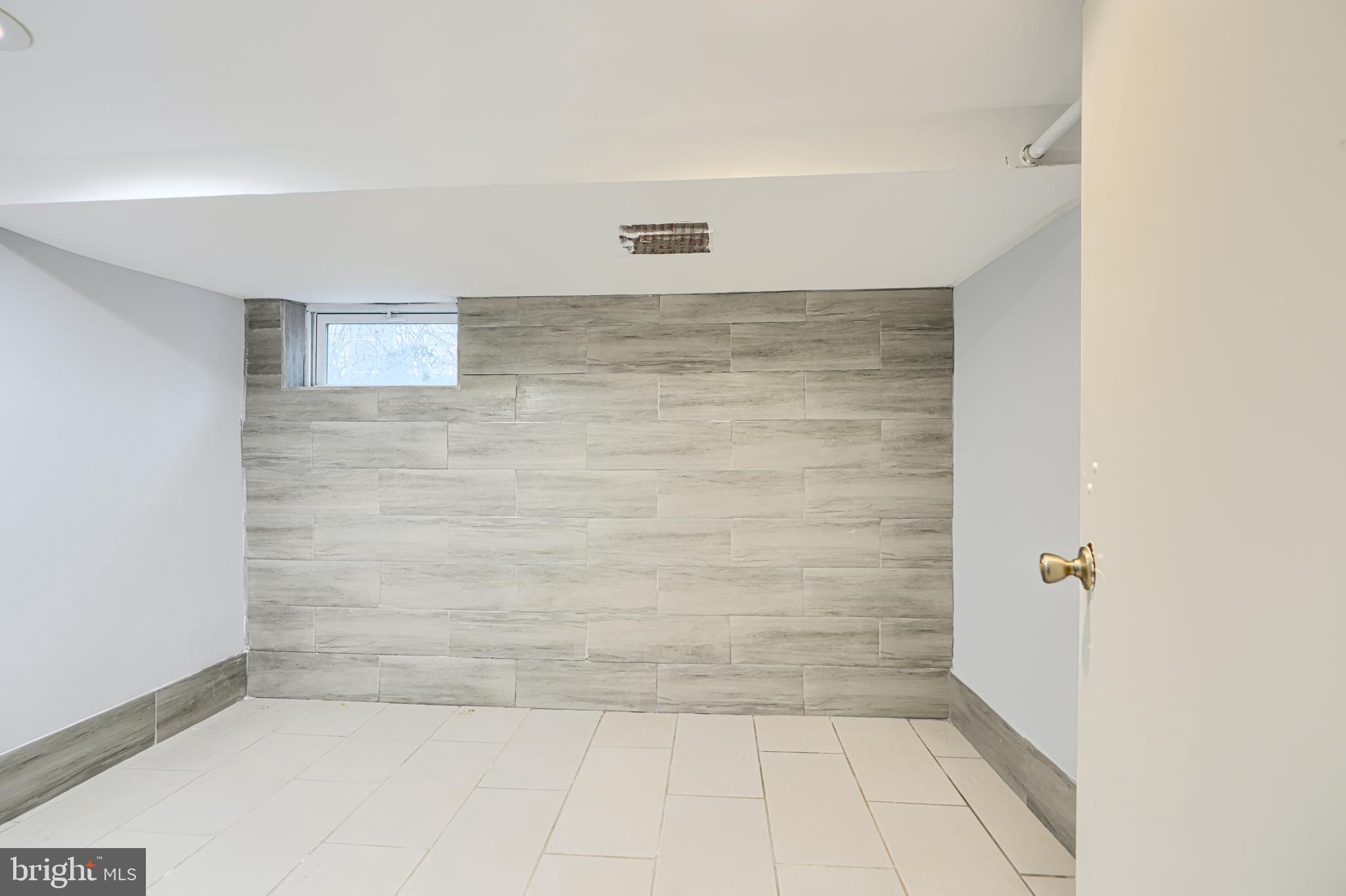 619 North Point Road Baltimore, MD 21224 - Photo 54 of 68 Middle lower level bedroom