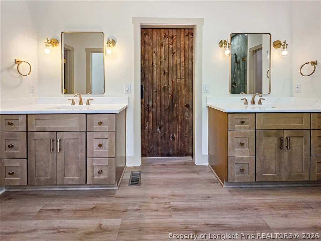 900 Niagara Carthage Road Carthage, NC 28327 - Photo 11 of 38 a bathroom with a double vanity sink mirror and