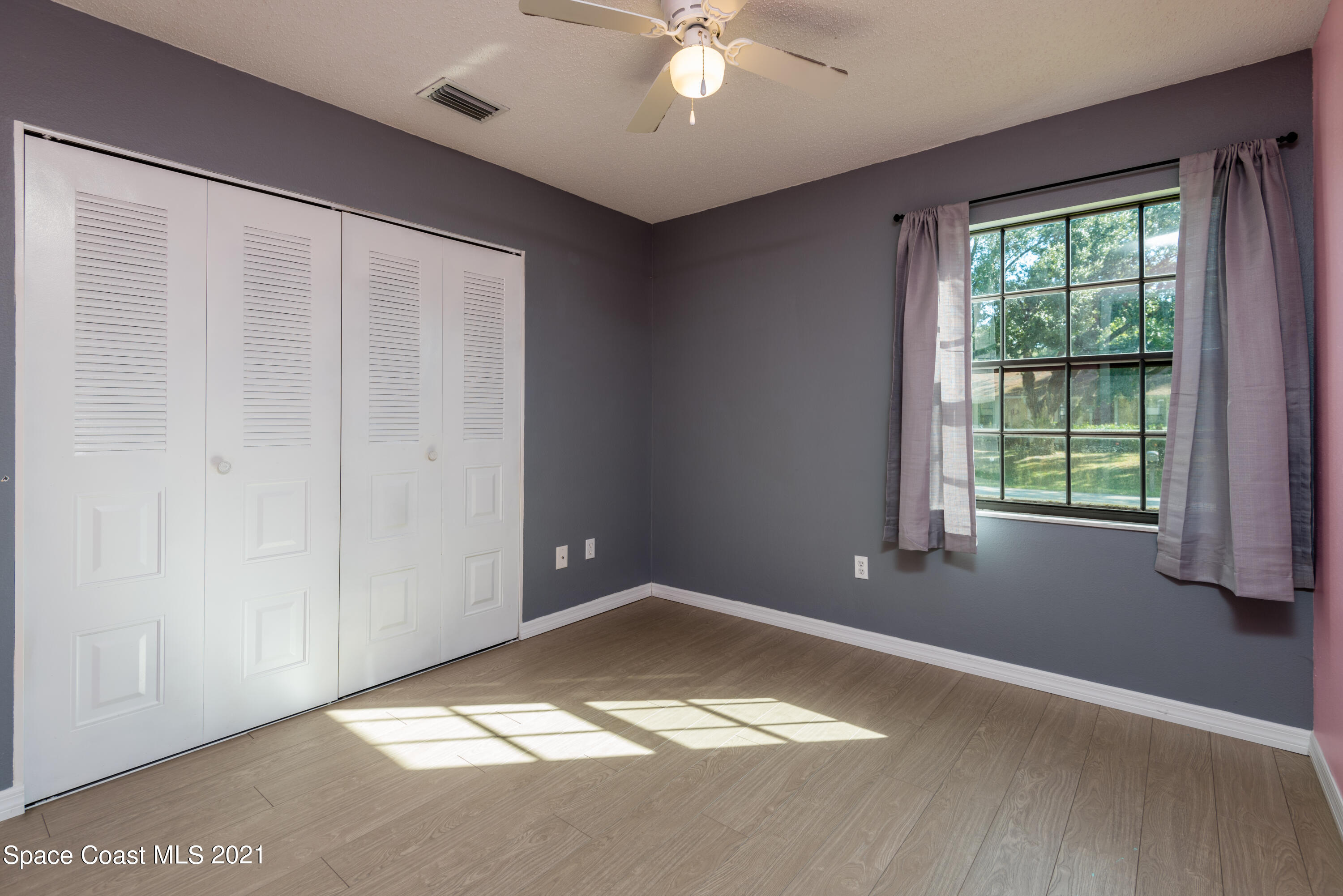 1077 San Rafael Road Southwest Palm Bay, FL 32908 - Photo 8 of 13 a view of an empty room with a window