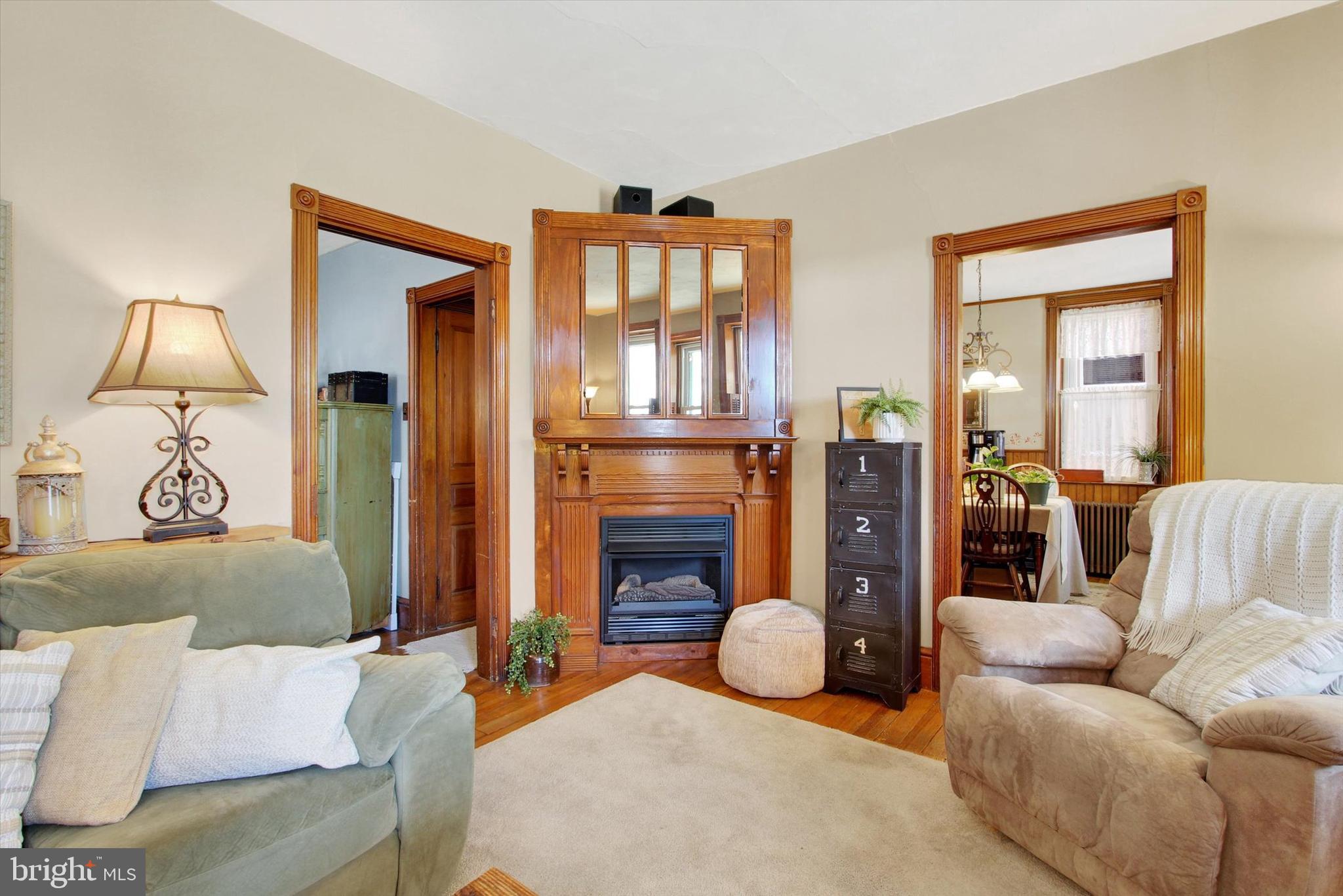6 North Water Street Spring Grove, PA 17362 - Photo 16 of 37 a living room with furniture a lamp and a fireplace