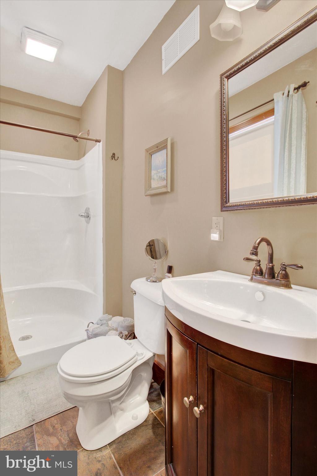 6 North Water Street Spring Grove, PA 17362 - Photo 18 of 37 a bathroom with a sink a toilet and shower