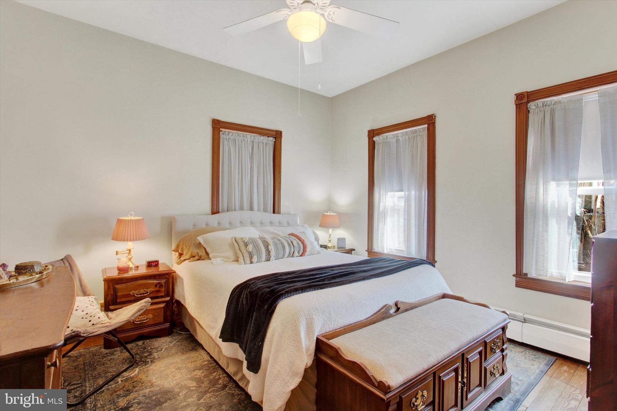 6 North Water Street Spring Grove, PA 17362 - Photo 21 of 37 a bedroom with a bed and a chandelier