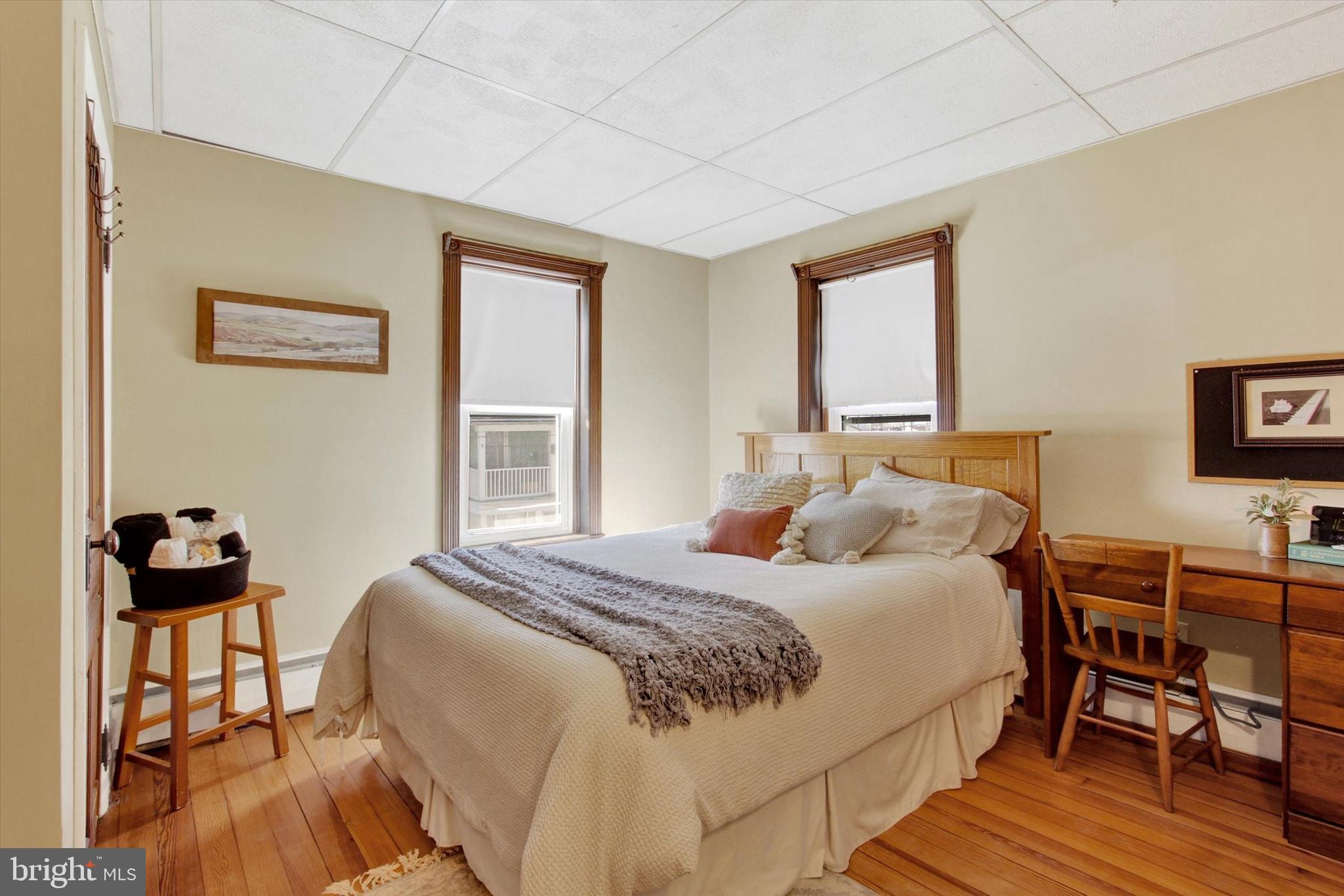 6 North Water Street Spring Grove, PA 17362 - Photo 23 of 37 a bedroom with a bed and wooden floor