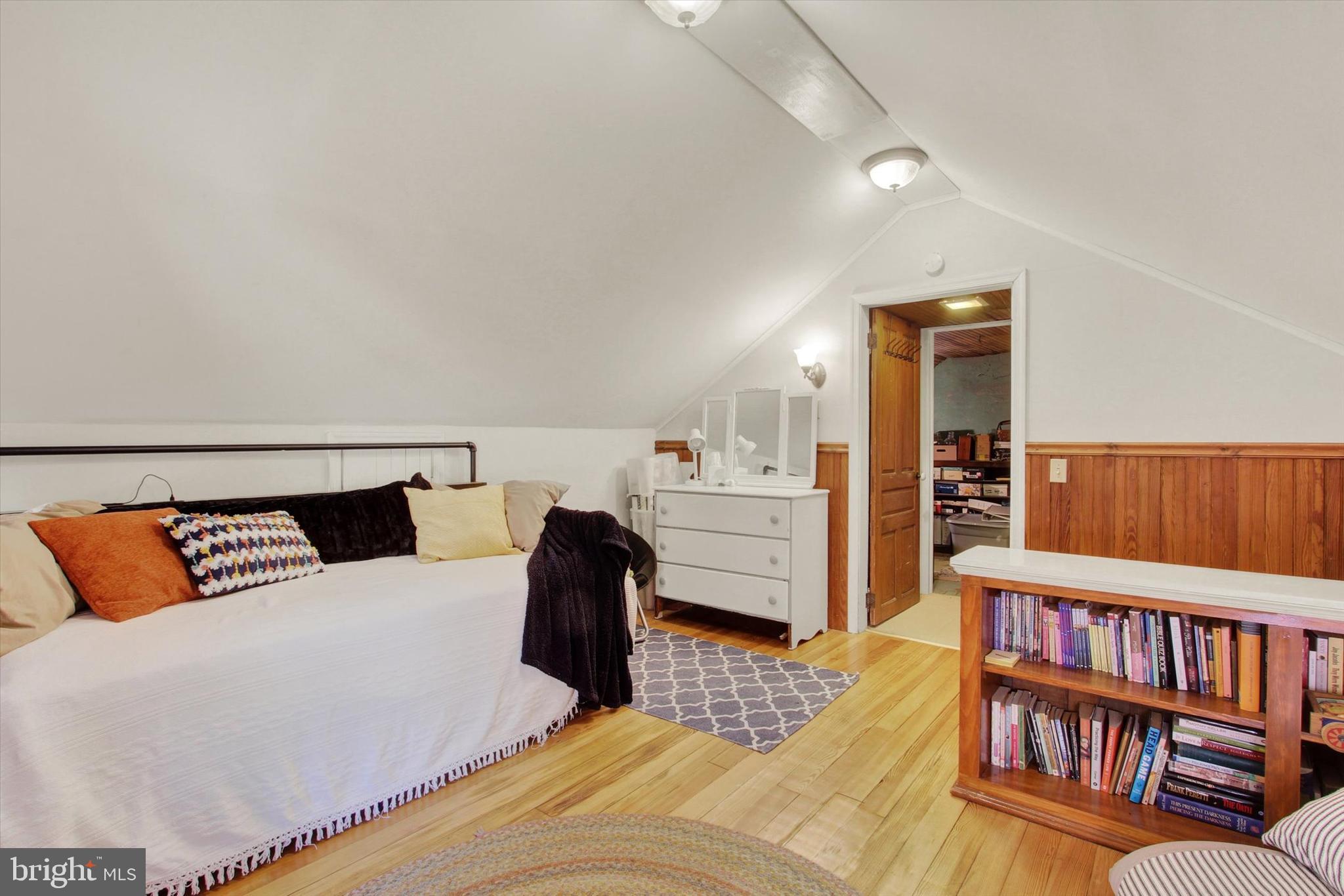 6 North Water Street Spring Grove, PA 17362 - Photo 27 of 37 a bedroom with furniture and a book shelf