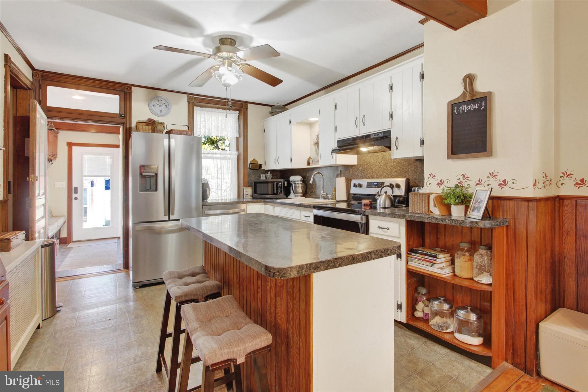 6 North Water Street Spring Grove, PA 17362 - Photo 6 of 37 a kitchen with stainless steel appliances granite countertop a sink refrigerator and cabinets