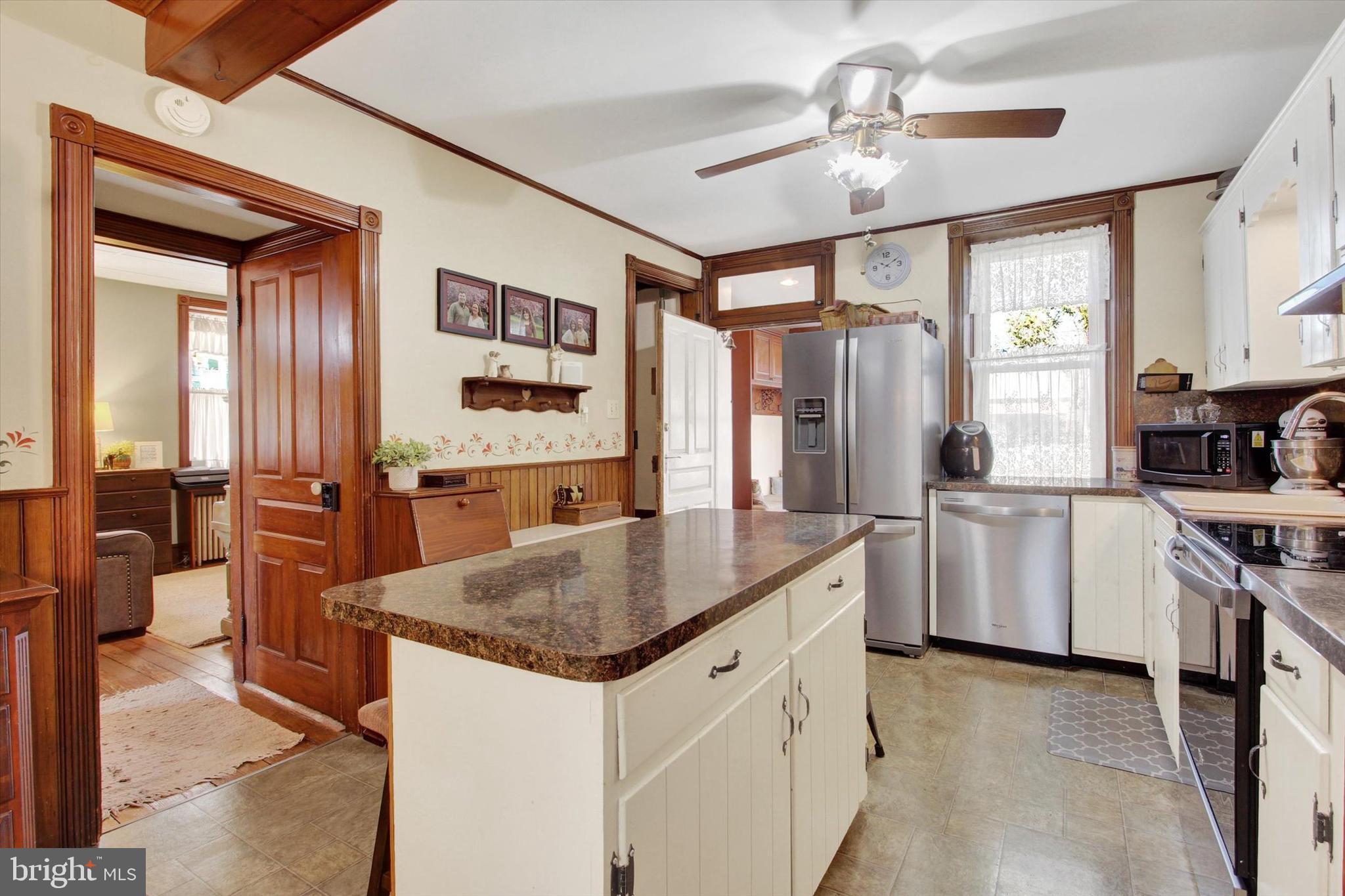 6 North Water Street Spring Grove, PA 17362 - Photo 9 of 37 a kitchen with stainless steel appliances granite countertop a sink a stove and a refrigerator