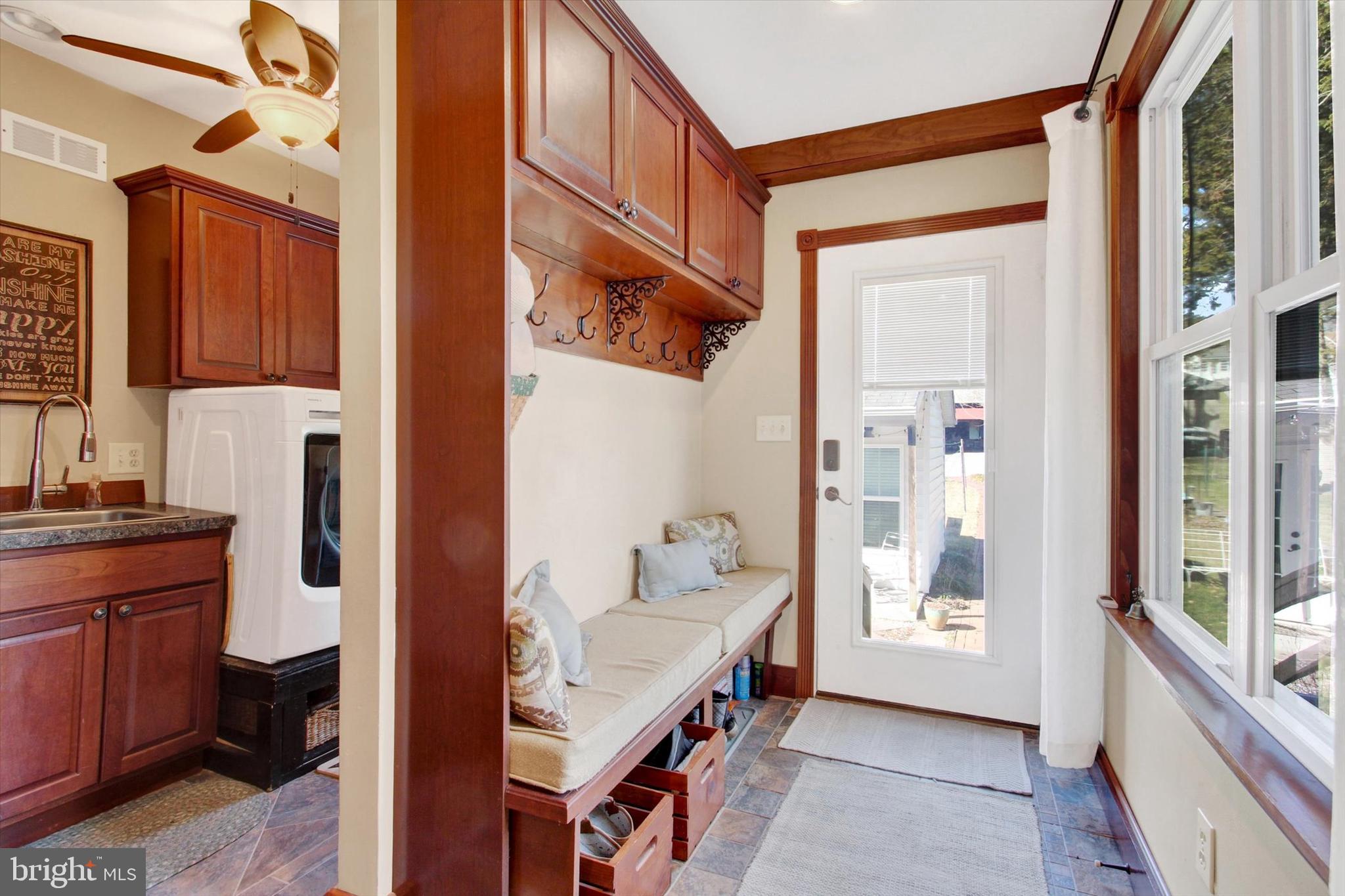 6 North Water Street Spring Grove, PA 17362 - Photo 10 of 37 a hallway with cabinets a wooden floor and a window