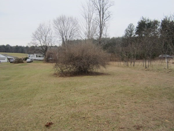 Lot 54 Valley Road Southampton, MA 01073 - Photo 1 of 14 a view of dirt field and trees around