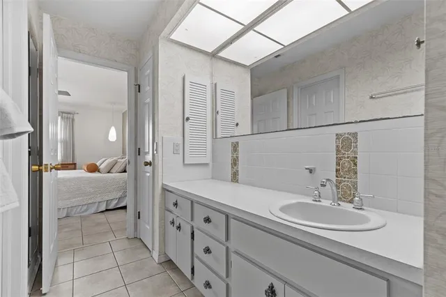 a en suite bathroom with a double sink and mirror