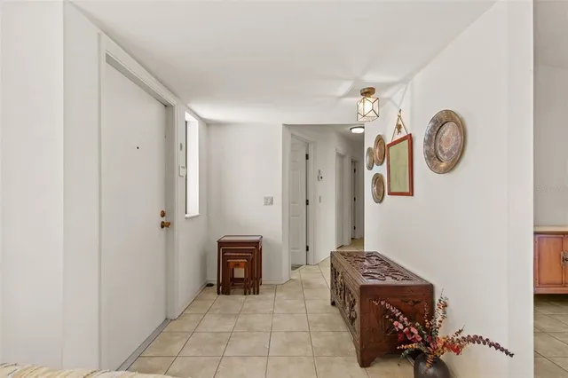 a view of livingroom with workspace and a mirror