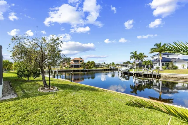 a view of a lake with a house in the background