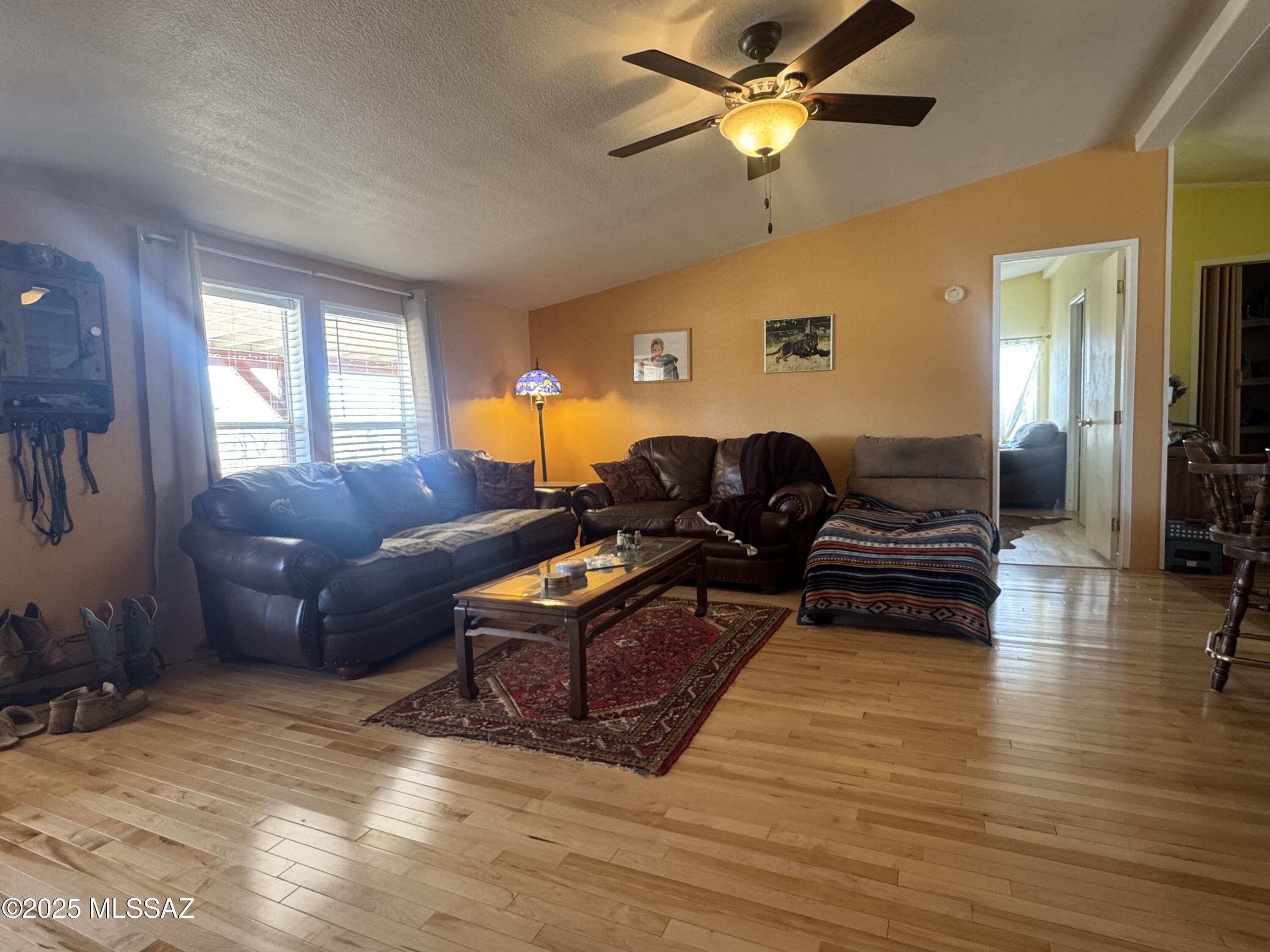 12440 South Coleman Road Tucson, AZ 85735 - Photo 17 of 45 a living room with furniture and a large window
