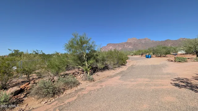 a view of a road with a mountain in the background