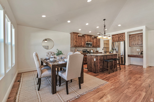 1288 North Horizon View Loop Elk Ridge, UT 84651 - Photo 11 of 40 Dining room featuring light wood-style floors, vaulted ceiling, and recessed lighting
