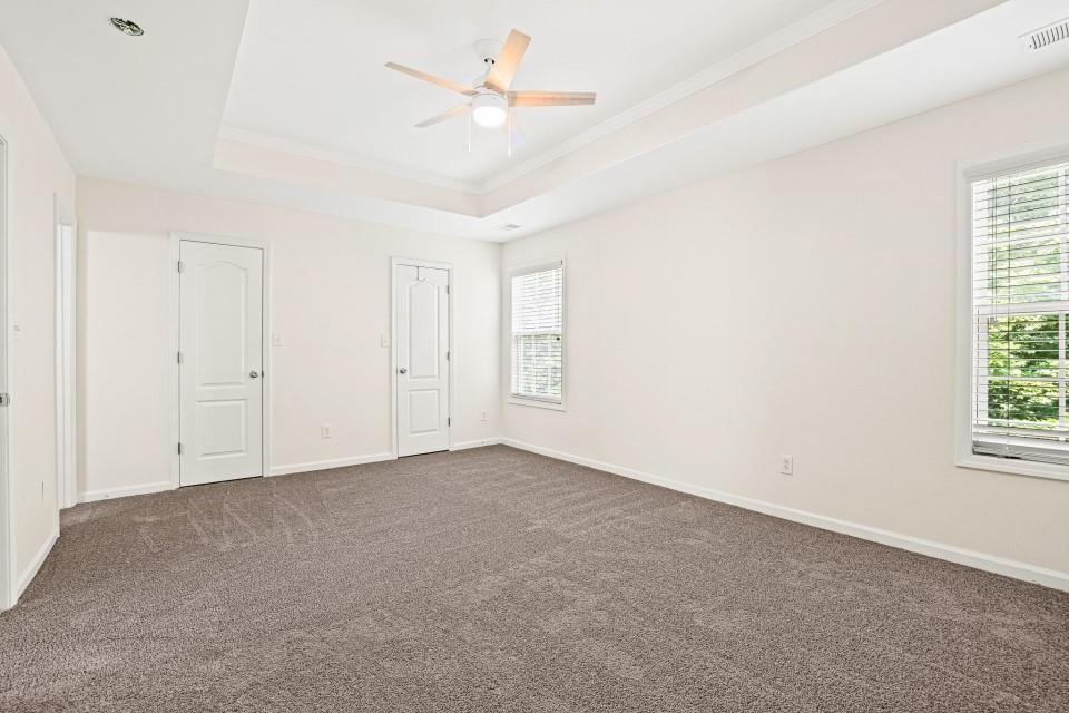 810 Ash Street Canton, GA 30114 - Photo 11 of 16 an empty room with windows and fan